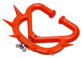 Orange plastic cattle weaner with inward‑facing spikes and hinged clamp design.
