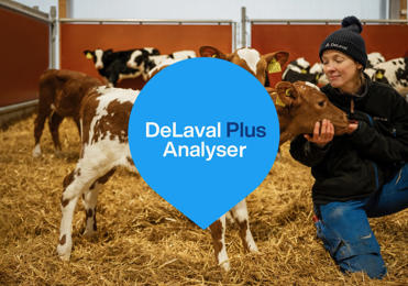 Girl cuddeling with calf - DeLaval Plus Analyser